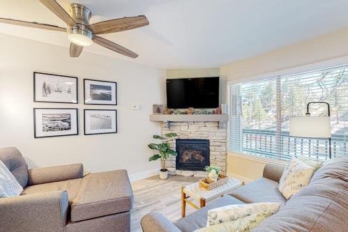 a living room with a couch and a fireplace at Tranquil condo in Stateline sleeps 4 in Stateline