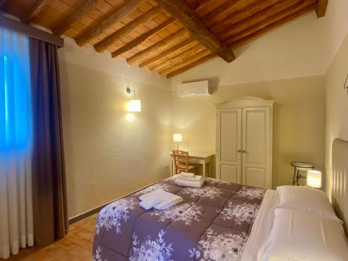 a bedroom with a bed in a room at Agriturismo Villa Adimari in Cerreto Guidi