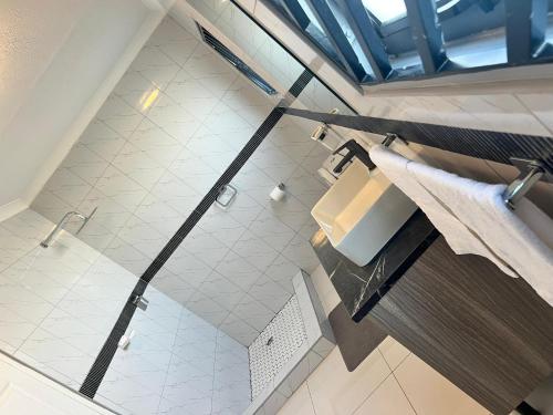 an overhead view of a bathroom with a shower at Florino GuestHouse in Rundu