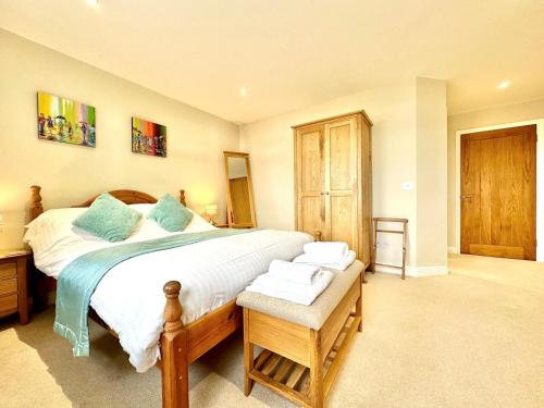 a bedroom with a large bed with towels on it at 2 Bed in Bideford oc-73895 in Westward Ho