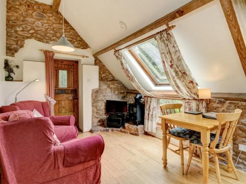 a living room with a couch and a table at Horner- Ukc4923 in Timberscombe
