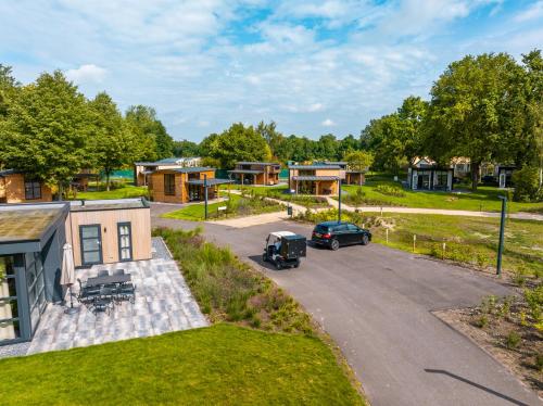 an aerial view of a house with a car parked in a driveway at EuroParcs Kaatsheuvel in Kaatsheuvel