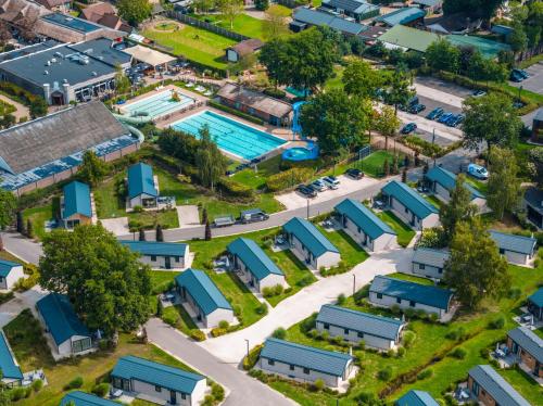 an aerial view of a suburb with a pool at EuroParcs Kaatsheuvel in Kaatsheuvel