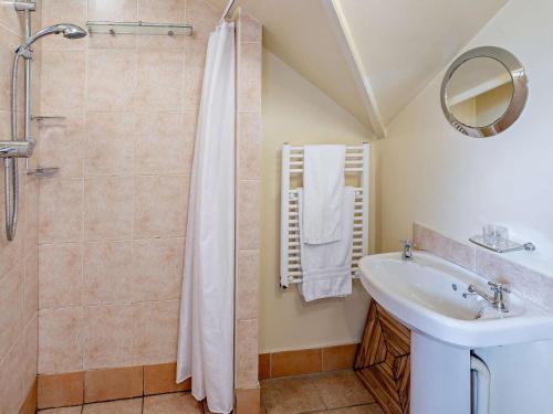 a bathroom with a shower and a sink at 1 Bed in Brecon oc-bn367 in Bwlch