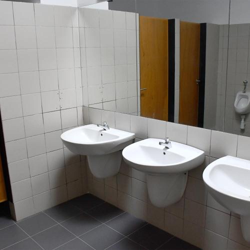 a bathroom with two sinks and a mirror at CEAM Tabarca in Tabarca