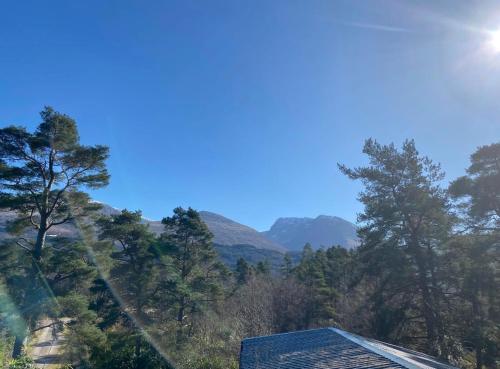a view of the mountains from a house at Solstice Cabin in Torlundy