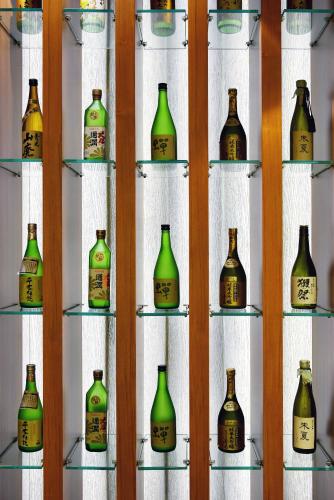 a display of bottles on shelves in a room at Fullon Hotel Taipei, Central in Taipei
