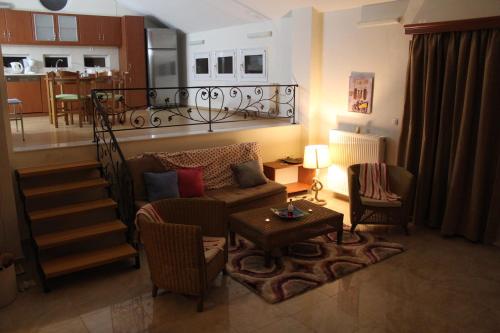 a living room with a couch and a table at Villa Frati Gorge in Fratíon