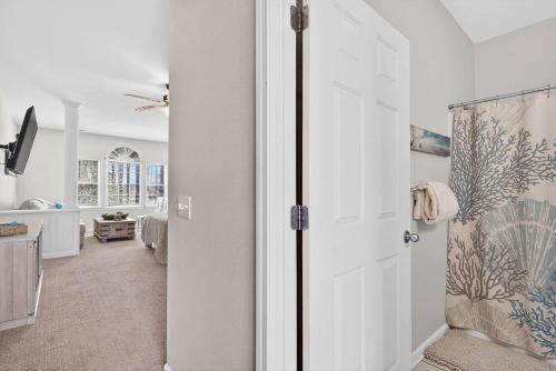 a white door in a room with a living room at 2BR Condo with Golf Views Near Sunset Beach in Sunset Beach