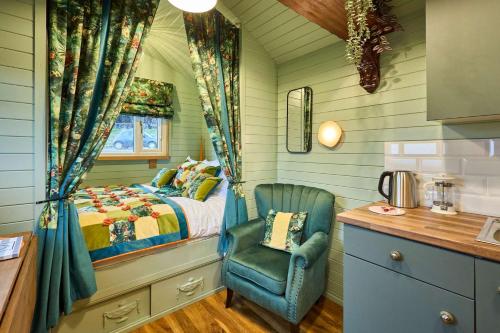 a small bedroom with a bed and a chair at Host & Stay - Curlews Rest in Longridge