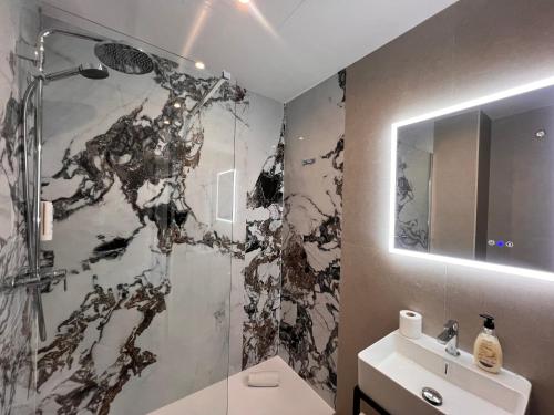a bathroom with a shower and a toilet and a sink at Iberflat San Gregorio in Seville