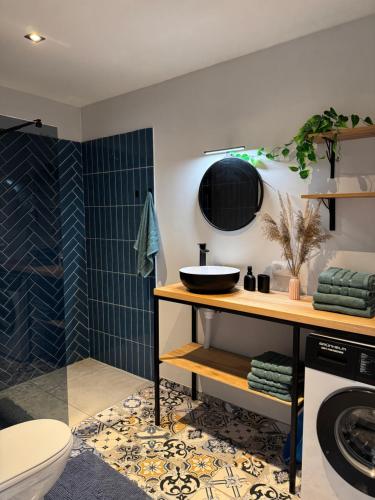 a bathroom with a sink and a toilet and a shower at zelena khata in Sopot