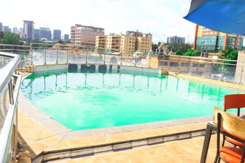 a large swimming pool on top of a building at Emeli apartments in Nairobi