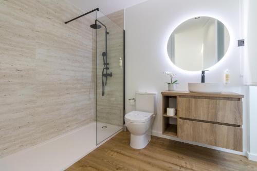 a bathroom with a shower and a toilet and a sink at Solar dos Arcos • Luxury Rural Retreat & Heated Po in Macieira da Lixa