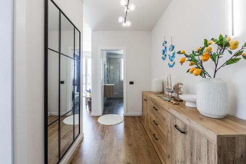 a bathroom with a sink and a mirror at Talea Elegant Escape by PikHost in Lezhë