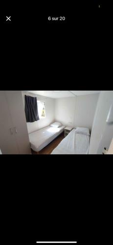 a small room with a couch and a window at Nature in Saint-Pierre-dʼOléron
