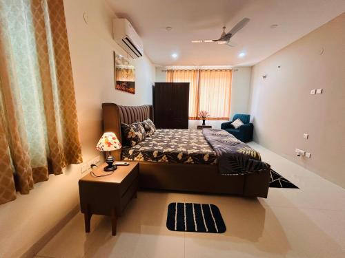 a bedroom with a large bed in a room at Premium Villa Stay Near the Airport Perfect for Families & Business Travelers in Hyderabad