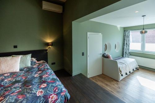 a bedroom with a bed and a window at Nova Zembla in Mechelen