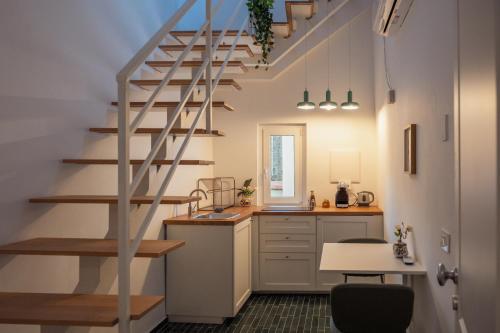 a kitchen with a spiral staircase in a room at Casa Martù in Palermo