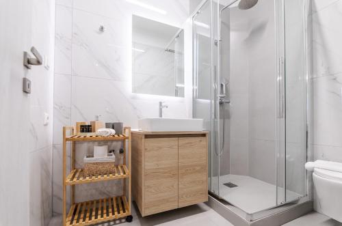 a bathroom with a sink and a shower at KAPA Luxury Living in Volos