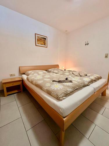 a large bed in a room with at Ferienwohnung Theisen in Bernkastel-Kues