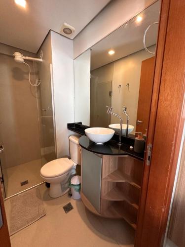 a bathroom with a sink and a toilet and a shower at Flat em Brasilia - Parque do Sudoeste in Brasília