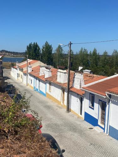 a row of houses with blue and white at Casa de Benavila in Benavila