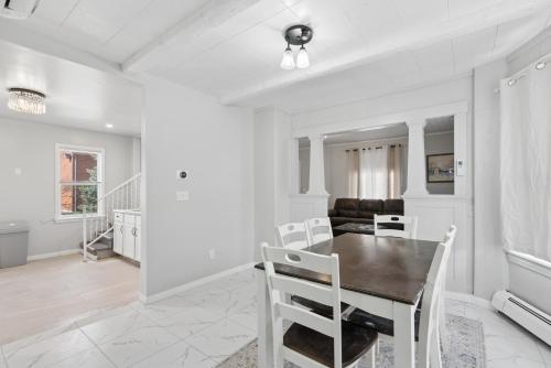 a dining room with a table and chairs at Home In Highland Park in Saint Paul