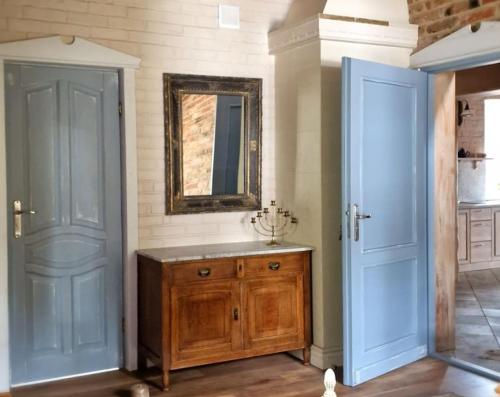 a bathroom with a wooden sink and a mirror at Akacjowe Wzgórze in Wielęcin
