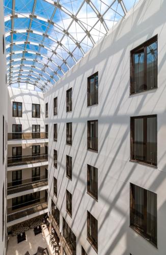 an external view of a building with a glass ceiling at Europa Royale Bucharest in Bucharest
