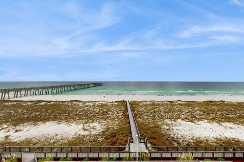 a view of a beach with a pier at Summerwind 0402 in Navarre
