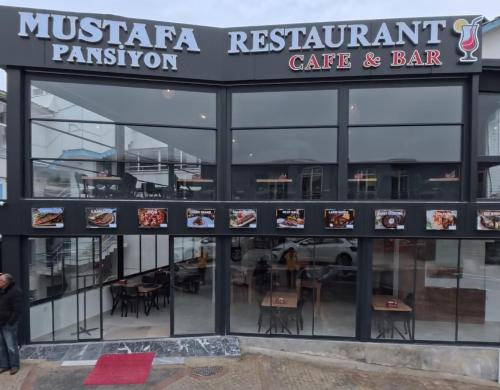 a restaurant with a sign that readsmusica restaurant cafe and bar at Mustafa Hotel Restaurant in Pamukkale