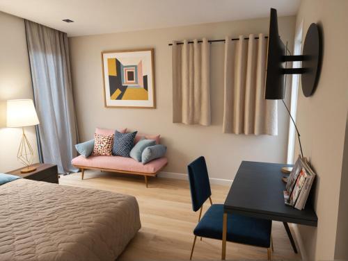 a bedroom with a bed and a couch and a table at Stylish Residences Near Art Deco and LA Hotspots in Los Angeles