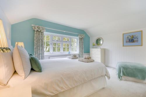 a bedroom with a large white bed and a window at 3 Bed in Knapton oc-1191 in Knapton