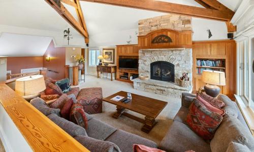 a living room with a couch and a fireplace at Forest Condominiums by Vail Resorts in Keystone