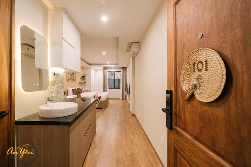 a bathroom with a sink and a mirror at An Yên Island - Art Boutique Stay with Dual Lake view in Hanoi