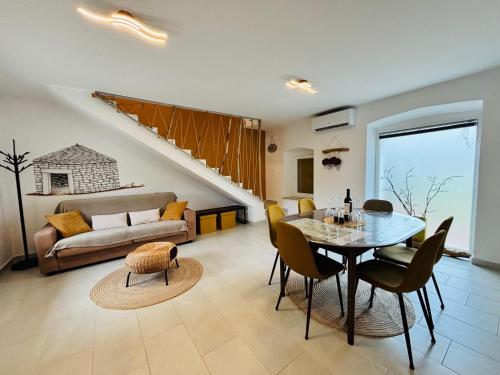 a living room with a table and a couch at Casa Viva in Umag