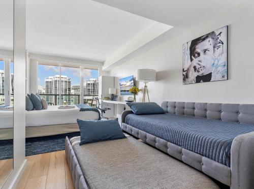 a bedroom with a couch and a bed in a room at Private Oasis at Arya in Miami