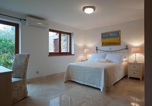 Katil atau katil-katil dalam bilik di Apartments - Villa Ana