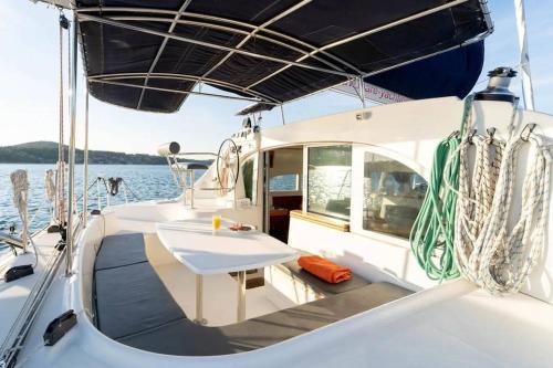 a table on a boat in the water at Nuit en Catamaran aux Iles de Lérins in Cannes