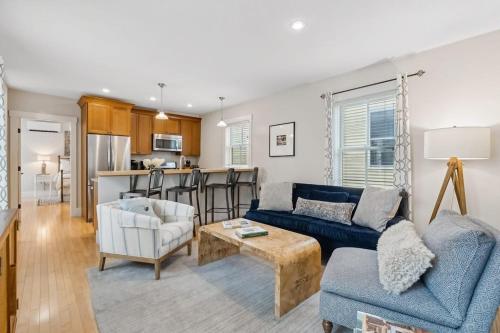 a living room with a couch and a table at The Heart of the West End #4 in Portland