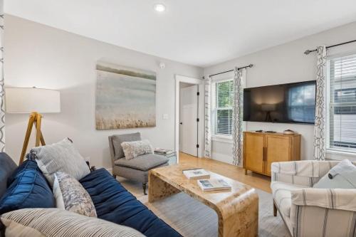a living room with a blue couch and a table at The Heart of the West End #4 in Portland