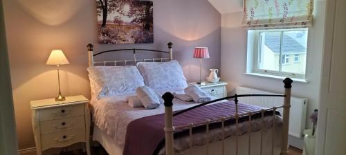 a bedroom with a bed and a window at Roseville in Limerick