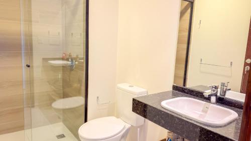 a bathroom with a toilet and a sink and a shower at Civis Jardinia Sky Studio 4B Pool & Sauna in Luque