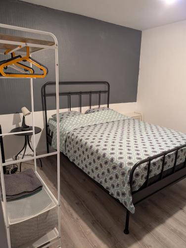 a bedroom with a bunk bed and a shelf at Saint Georges - ParisSmile in Villeneuve-Saint-Georges