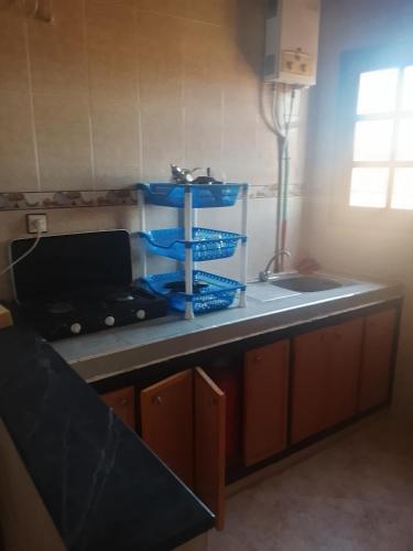 a kitchen with a counter with a sink and a counter top at Premium Services in Tatta