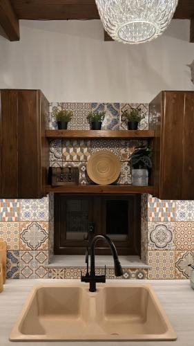 a kitchen counter with a sink and a sink at Domus Fidias in Rhodes Town