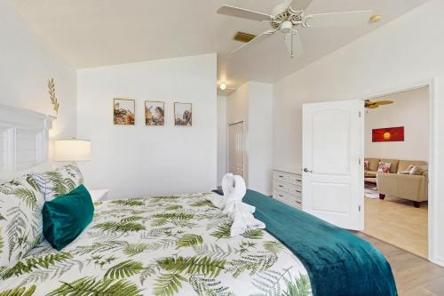 a bedroom with a bed and a ceiling fan at Sebastian Serenity in Sebastian