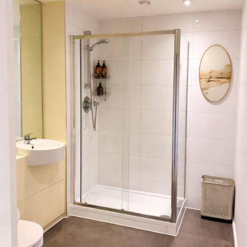 a bathroom with a shower and a sink at New,London Hideaway Studio in Woking