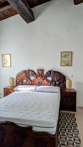 a bedroom with a bed with animals on it at Il Pollaio di Pilade in Lerici